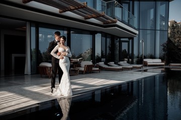 Loving couple at the hotel on a honeymoon.Just married. Honeymoon concept. Romantic relations. True love. Family love. Couple in love. Cute relationship. Man and woman cuddle nature background.  Toget