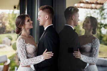 Loving couple at the hotel on a honeymoon.Just married. Honeymoon concept. Romantic relations. True...