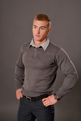 Portrait of handsome young man posing in studio