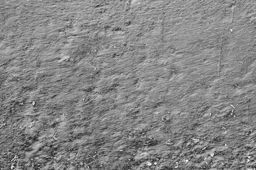 Texture of a concrete wall with cracks and scratches which can be used as a background