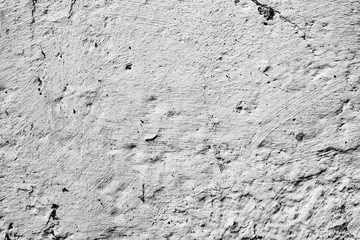 Texture of a concrete wall with cracks and scratches which can be used as a background