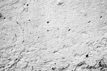 Texture of a concrete wall with cracks and scratches which can be used as a background