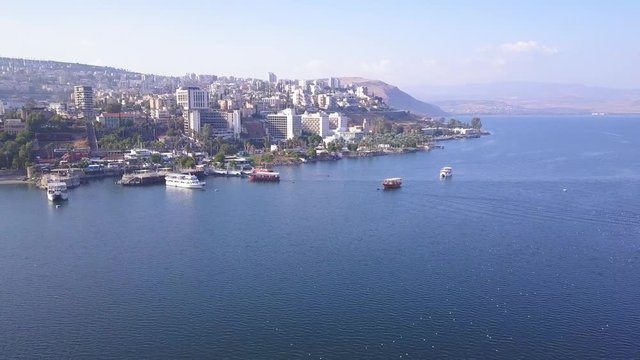 Sea of Galilee in Tiberias, Israel. Aerial view of the coastline, the old city and the hotels zone.