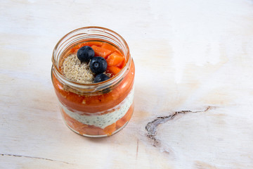 Papaya with chia seed pudding and blueberry