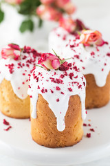 Traditional Easter bread decorated sugar icing, raspberries and flowers