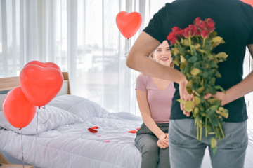 Couple surprise Rose flower in bed room morning Valentine's day