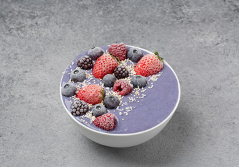 Smoothie bowl with frozen berries, bananas and yogurt. Healthy breakfast. 
