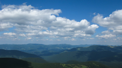 view of the Carpathian mountains on a sunny summer day from the top of Goverla Mountain, Carpathians, Ukraine