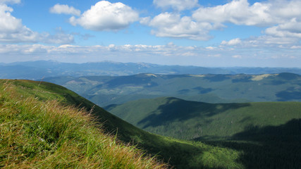 view of the Carpathian mountains on a sunny summer day from the top of Goverla Mountain, Carpathians, Ukraine