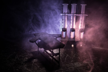 Prisoner handcuffed to death by lethal injection, vial with sodium thiopental and syringe on top of...