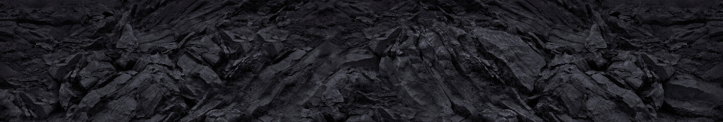 Black mountain texture closeup. Long grunge banner. The geometric shape of the stone 3d effect. Black abstract grunge background.