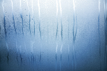 Blue Glass with Condensate, Window with Steam and Water as Background or Texture	