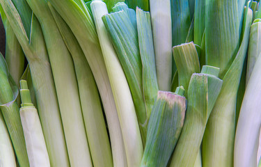 Bunch of leek on the market strand. Background image.