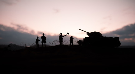 War Concept. Military silhouettes fighting scene on war fog sky background, World War German Tanks Silhouettes Below Cloudy Skyline At night. Attack scene.