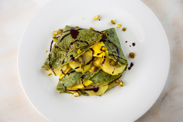 Crepes with mango and kiwi