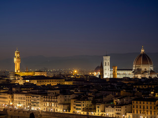 Fototapeta na wymiar Florence in Tuscany, Italy. View over the city in the late evening January 2020. Taking in the Duomo aka Cathedral and Signoria Tower.