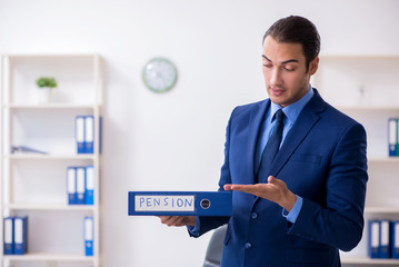 Young male accountant working in the office