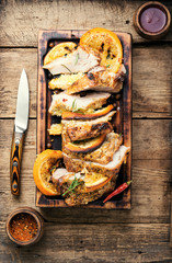 Baked meat in oranges