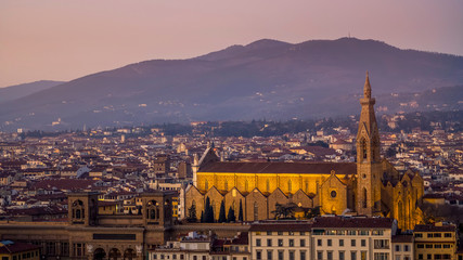 Fototapeta na wymiar Night landscape view over Florence, Italy, featuring the illuminated Basilica di Santa Croce Holy Cross .