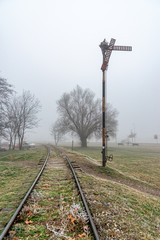 Novi Sad, Serbia - January 16, 2020: Railway line in Detelinara settlement in Novi Sad covered with...