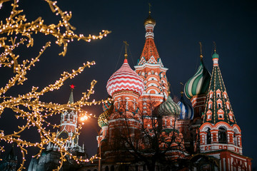 Moscow, Russia. St. Basil's Cathedral and Spasskaya Tower at night on New Year's holidays. View from Zaryadye park - 316513611
