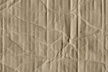Close up grainy decorative light brown vintage rough sheet of carton. Cardboard paper texture blank background. Brown color old pattern empty papercraft surface. Recycled ecology friendly material.