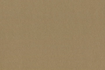 Close up grainy decorative light brown vintage rough sheet of carton. Cardboard paper texture blank background. Brown color old pattern empty papercraft surface. Recycled ecology friendly material.