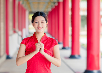Asian young woman in old traditional Chinese dresses in the Temple