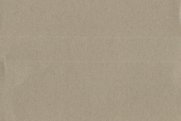 Close up grainy decorative light brown vintage rough sheet of carton. Cardboard paper texture blank background. Brown color old pattern empty papercraft surface. Recycled ecology friendly material.