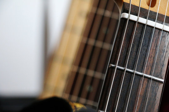 Instruments - electric guitar sharp close-up. Hi-res stock image