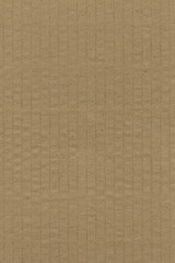 Close up grainy decorative light brown vintage rough sheet of carton. Cardboard paper texture blank background. Brown color old pattern empty papercraft surface. Recycled ecology friendly material.