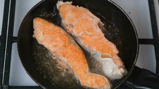 fresh red fish pieces fry in a pan, fish cooking