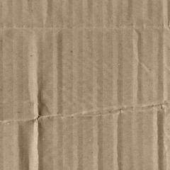 Close up grainy decorative light brown vintage rough sheet of carton. Cardboard paper texture blank background. Brown color old pattern empty papercraft surface. Recycled ecology friendly material.