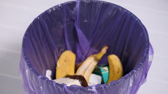 Throwing away piece of cheesecake into garbage bin. Concept of choice, life changing moment. Say no to sugar and unhealthy fats