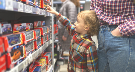 Fototapeta na wymiar boy in toy market