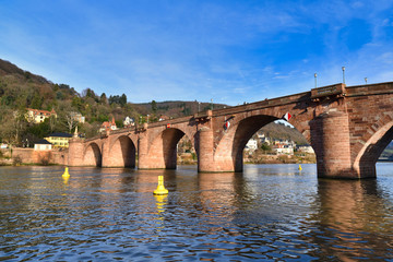 Fototapeta premium Karl Theodor Bridge, also known as the Old Bridge, called 'Alte Brücke in German, an arch bridge in city Heidelberg in Germany that crosses the Neckar river