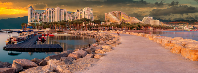 Morning panoramic view from public walking pier on central beach and promenade of Eilat - famous...