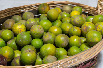 Many tangerines in the basket