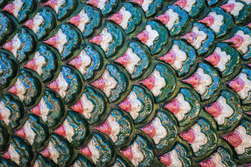 Texture of fish scale made from ceramic tiles. © jack-sooksan