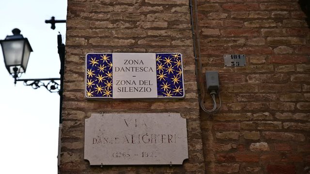 Ravenna, Italy, December 2019. License plate of the Dante area or zone of silence: celebrates the magnificent mosaics of the city, the signs of the streets are embellished with this art form.