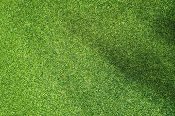 Obraz premium Green background from artificial grass. Copy space.