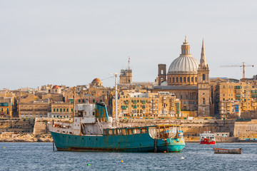Fototapeta na wymiar St.Paul cathedral and other historical buildings.Sunset panorama view of Valletta, Malta.