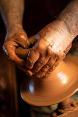 Craftsman making pottery 