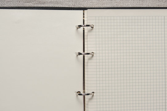 Notebook with pages in a cell. Blank page of open notebook
