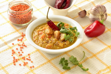 Dal, red lentil soup with turmeric, garlic, chili and cilantro. Indian food.