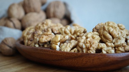 walnut kernels in a wooden dish