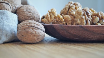 walnut kernels in a wooden dish