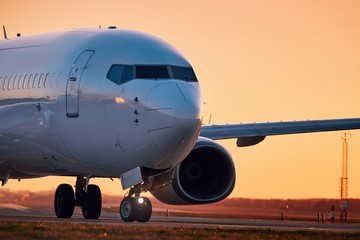 Fototapeta na wymiar Airplane on airport runway
