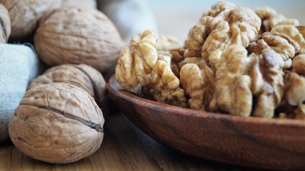 walnut kernels in a wooden dish