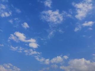 Obraz premium Cirrus, white clouds in the blue sky natural background beautiful nature environment